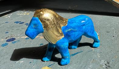 Lions at Large painted sculpture