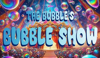 A colourful picture of bubbles amongst a theatre tent