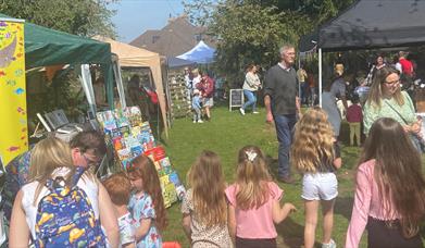 Friends and families enjoying market stalls.