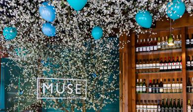 Muse Brasserie sign with balloons