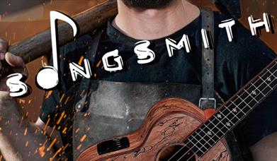 Artist Karim Bedda with a hammer and guitar