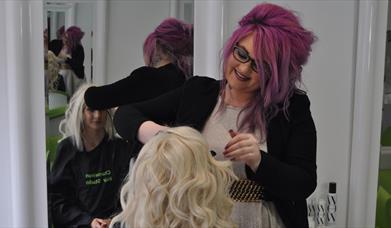 Lady having her hair cut