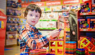 Young boy playing with toys